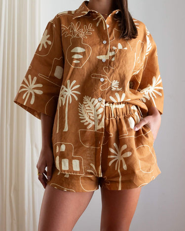 Close-up of Cashew Linen Shorts showing paper bag waistband for extra comfort and hidden pockets