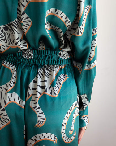Close up details of Tigris Green Silk Pant - including wide waistband, eye-catching pattern and flattering silhouette