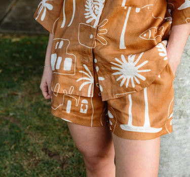 Cashew Linen Shorts showcasing hidden pockets along side seams for added convenience