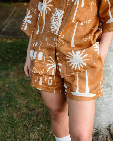 Cashew Linen Shorts showcasing hidden pockets along side seams for added convenience