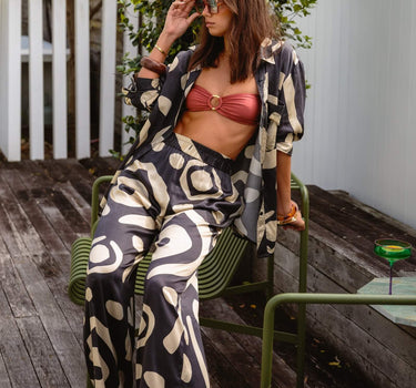 Model wearing KENI Sleepwear wide-leg silk pants, showing elasticated waist and relaxed fit