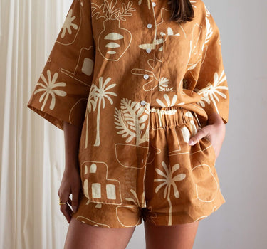 Close-up of Cashew Linen Shorts showing paper bag waistband for extra comfort and hidden pockets