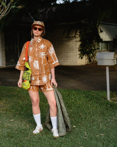 Cashew Linen Shirt worn casually with matching KENI shorts for effortless style