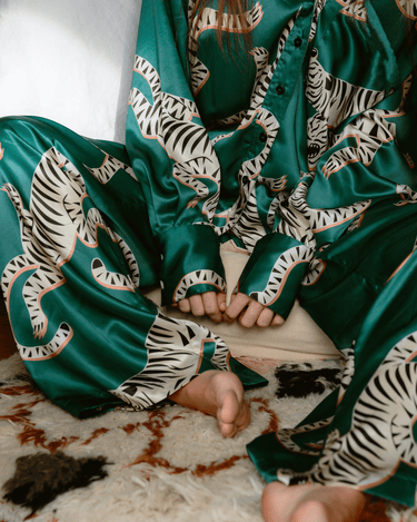 Close-up of Tigris Green Silk Pants by KENI Sleepwear highlighting the luxurious mulberry silk fabric and fine craftsmanship.